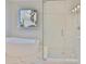 Bathroom featuring a soaking tub and glass enclosed shower at 3616 W Platt St, Tampa, FL 33609