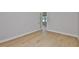 Bright bedroom featuring hardwood floors and a glass door entrance at 3616 W Platt St, Tampa, FL 33609