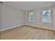 Spacious bedroom features hardwood floors and two windows bringing in lots of light at 3616 W Platt St, Tampa, FL 33609