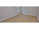 Bright bedroom featuring hardwood floors and a window at 3616 W Platt St, Tampa, FL 33609