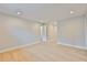 Large bedroom with hardwood floors, recessed lighting and doorways to other rooms at 3616 W Platt St, Tampa, FL 33609