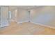 Bedroom with light hardwood floors, doors to hallways and a closet, and recessed lighting at 3616 W Platt St, Tampa, FL 33609