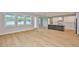 Bright, open-concept kitchen featuring a center island, stainless steel appliances, and hardwood floors at 3616 W Platt St, Tampa, FL 33609