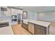 Modern kitchen featuring an island, quartz countertops, and stainless steel appliances at 3616 W Platt St, Tampa, FL 33609