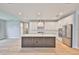 Well-lit kitchen showcases an island, stainless steel appliances, and modern cabinetry at 3616 W Platt St, Tampa, FL 33609