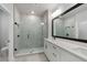 Modern bathroom featuring a glass shower, double vanity, and sleek black hardware accents at 406 N Westland St # 1, Tampa, FL 33609