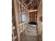 Bathroom with exposed wood framing, rough plumbing, and a modern black tub ready for installation at 406 N Westland St # 1, Tampa, FL 33609