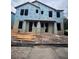 Two-story exterior showing a newly constructed home with blue weather-resistant barrier ready for siding at 406 N Westland St # 1, Tampa, FL 33609