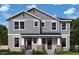 Charming two-story home featuring gray siding, stone accents and a well-manicured lawn at 406 N Westland St # 1, Tampa, FL 33609