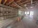 Spacious living room area framed and under construction showcasing the home's layout at 406 N Westland St # 1, Tampa, FL 33609