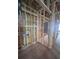Framed utility area with electrical and plumbing installations, ready for drywall and appliances at 406 N Westland St # 1, Tampa, FL 33609