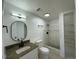 Updated bathroom featuring a granite vanity, tiled shower, and modern fixtures at 4322 Baden Dr, Holiday, FL 34691