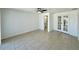 Bedroom with tiled floor and adjacent ensuite bathroom at 4322 Baden Dr, Holiday, FL 34691