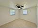 Cozy bedroom with tiled floors and natural light from two windows at 4322 Baden Dr, Holiday, FL 34691