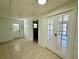 Bright bonus room with tiled floors and glass paneled doors at 4322 Baden Dr, Holiday, FL 34691