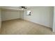 Living area with tiled floors, neutral walls, and an adjacent breakfast bar to the kitchen at 4322 Baden Dr, Holiday, FL 34691