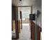 Hallway showing studs for renovation, connecting various rooms, offering potential for design upgrades at 4580 Overlook Ne Dr # 189, St Petersburg, FL 33703