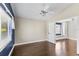 Spacious bedroom featuring hardwood floors, vaulted ceiling and neutral paint at 4690 Wrentham Pl, Palm Harbor, FL 34685