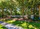 Devonshire community sign surrounded by mature trees and lush landscaping at 4690 Wrentham Pl, Palm Harbor, FL 34685