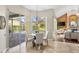 Dining area with view to backyard and chandelier, part of open concept living space at 4690 Wrentham Pl, Palm Harbor, FL 34685