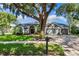 Charming home with manicured lawn and mature trees, offering curb appeal at 4690 Wrentham Pl, Palm Harbor, FL 34685