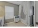 Bathroom offers tub and shower combo with cabinet for storage at 4815 Barnstead Dr, Riverview, FL 33578