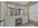 Bright bathroom with double sinks, vanity area, and access to tub/shower at 4815 Barnstead Dr, Riverview, FL 33578