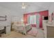 Bedroom features a comfortable bed, stylish decor and a bright, airy feel at 4815 Barnstead Dr, Riverview, FL 33578