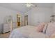 Bedroom has neutral walls, ceiling fan and an ensuite bathroom at 4815 Barnstead Dr, Riverview, FL 33578