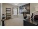 Bedroom with large window, desk, shelving unit and a ceiling fan at 4815 Barnstead Dr, Riverview, FL 33578