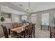 Inviting dining space adjacent to kitchen, illuminated by chandelier, perfect for Gathering dinners at 4815 Barnstead Dr, Riverview, FL 33578