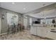 Efficient kitchen design with a breakfast nook and open layout leading to the living area at 4815 Barnstead Dr, Riverview, FL 33578