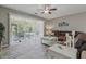 Bright living room with patio access, featuring a cozy seating area and modern finishes at 4815 Barnstead Dr, Riverview, FL 33578