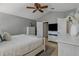 Relaxing main bedroom featuring soft carpet, fan, and ensuite bathroom at 4815 Barnstead Dr, Riverview, FL 33578