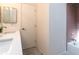 Bathroom featuring single sink vanity and a shower with retro pink tile at 623 Garland Cir, Indian Rocks Beach, FL 33785