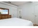 Comfortable bedroom with a dresser and ensuite bathroom that offers ample natural light at 623 Garland Cir, Indian Rocks Beach, FL 33785