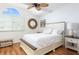 Bedroom with high ceilings, ceiling fan, and arched window providing natural light at 623 Garland Cir, Indian Rocks Beach, FL 33785