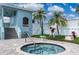 Enjoy the community hot tub surrounded by lush landscaping and palm trees for a relaxing experience at 623 Garland Cir, Indian Rocks Beach, FL 33785