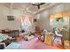Bedroom with vintage furnishings, ceiling fan, and natural light at 6427 15Th N St, St Petersburg, FL 33702
