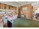 A living room featuring wood paneling and built-in shelving at 6427 15Th N St, St Petersburg, FL 33702