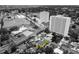 An eye-level aerial view of an inviting blue home in the center of a scenic neighborhood at 6750 Hibiscus S Ave, South Pasadena, FL 33707