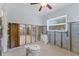 Bathroom featuring natural light, ceiling fan, and sink and toilet ready for installation at 6750 Hibiscus S Ave, South Pasadena, FL 33707