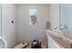 Remodeled bathroom featuring tile walls and a window at 6750 Hibiscus S Ave, South Pasadena, FL 33707