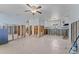 A view of the kitchen area featuring tile floors, white cabinets and modern appliances at 6750 Hibiscus S Ave, South Pasadena, FL 33707