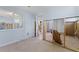 Living room featuring neutral paint, tile floors, and doorway looking into the kitchen at 6750 Hibiscus S Ave, South Pasadena, FL 33707