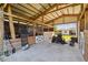 Interior view of the barn, equipped with stalls and ample space for equipment at 7627 Artifact Dr, Zephyrhills, FL 33541