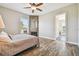 Charming bedroom featuring a decorative fireplace and convenient en-suite bath access at 7627 Artifact Dr, Zephyrhills, FL 33541