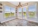 Sunny breakfast nook featuring wood-look floors and views to the exterior at 7627 Artifact Dr, Zephyrhills, FL 33541