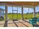 Enjoy the scenery from this screened porch with a wood deck, providing a serene outdoor space at 7627 Artifact Dr, Zephyrhills, FL 33541