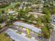 Aerial view of neighborhood with mature trees and blue-toned buildings at 8064 Brentwood Rd, Seminole, FL 33777